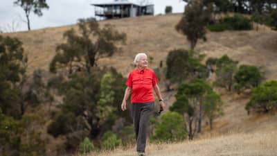Long term supporter and volunteer Annelie Holden with the Round House in the background.