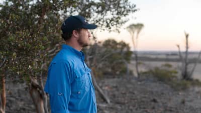 Alex Hams looks out over cleared land adjacent our reserves.