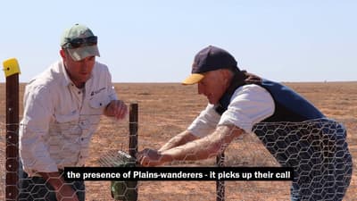 Graeme Finlayson and Kurt Tschirner setting up a song meter in arid plains of Boolcoomatta Reserve.